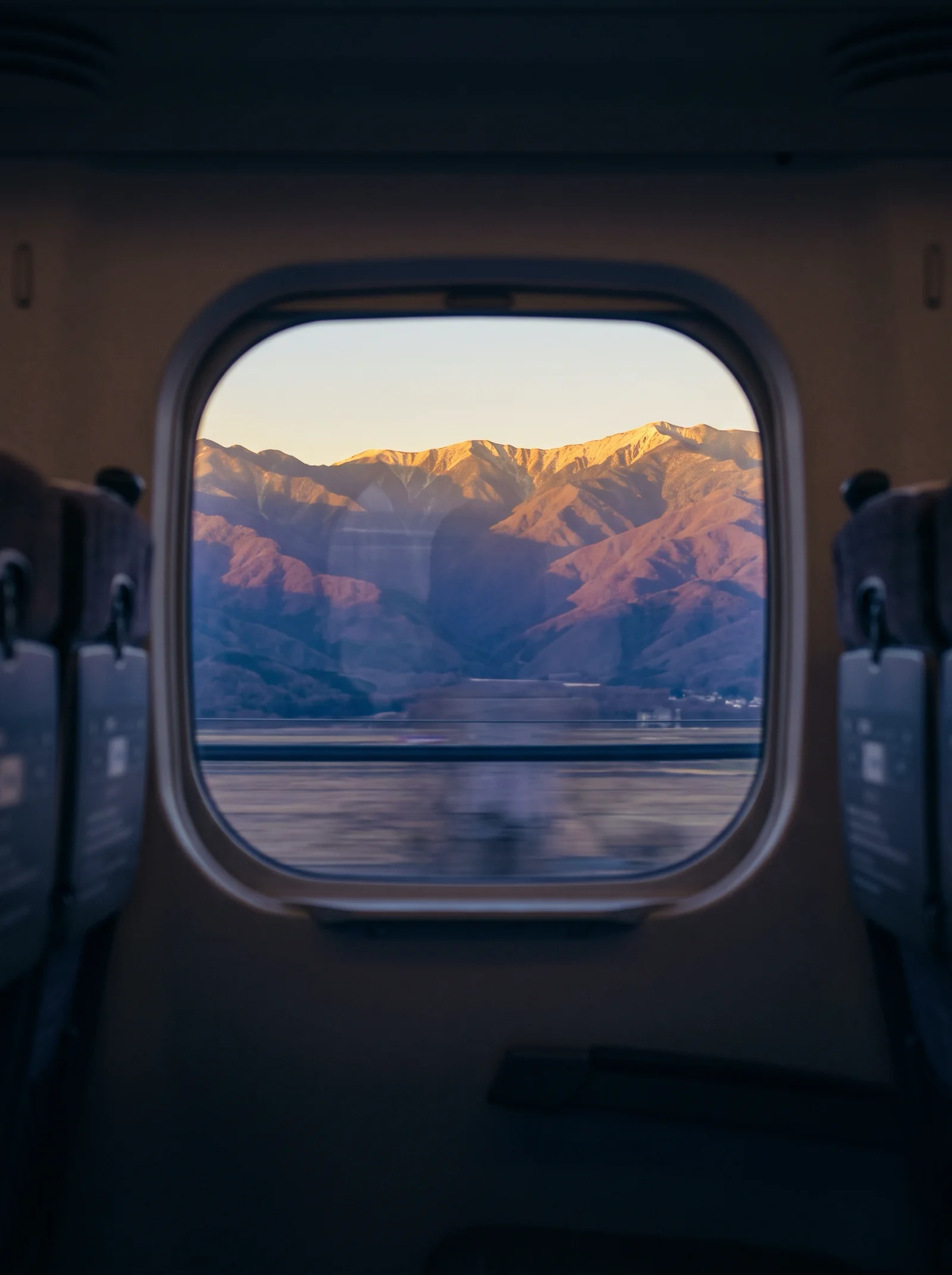 Golden Ridges Through a Shinkansen Window — AI-generated photograph
