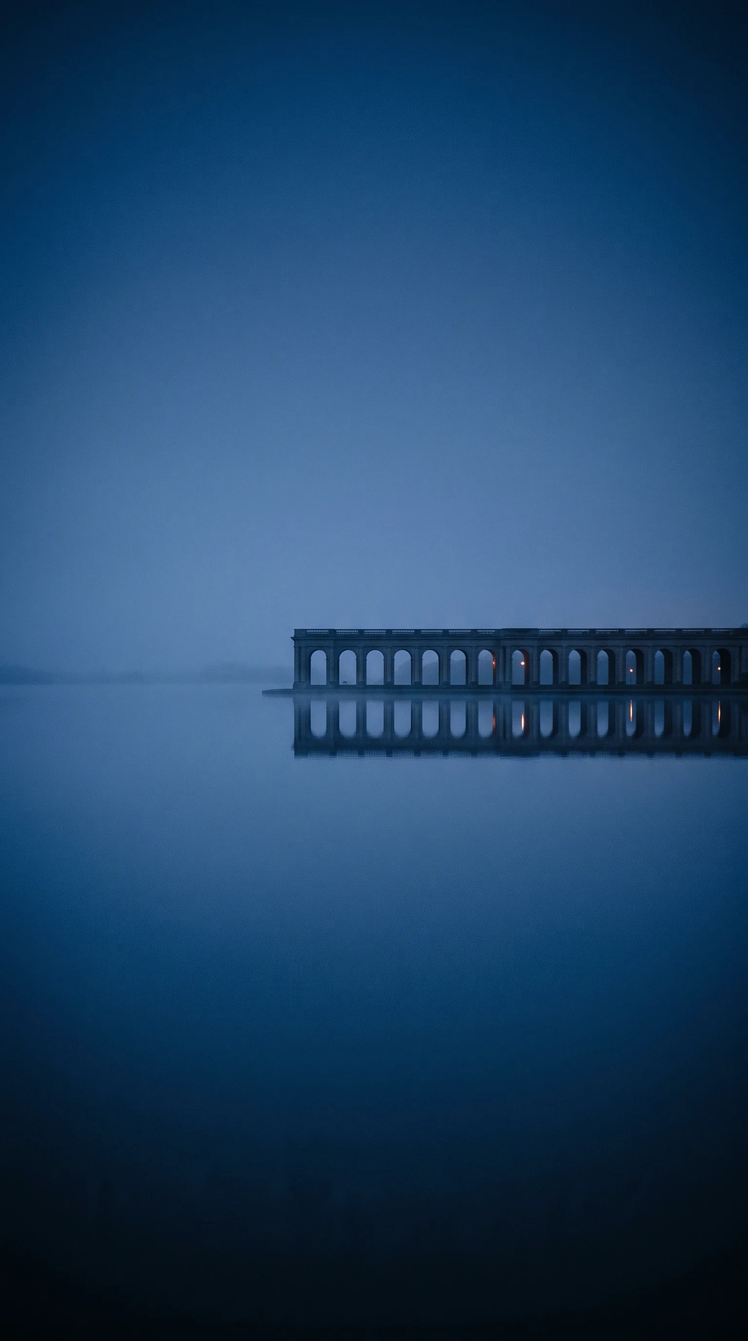 Classical Stone Arches Mirrored in Water — AI-generated photograph