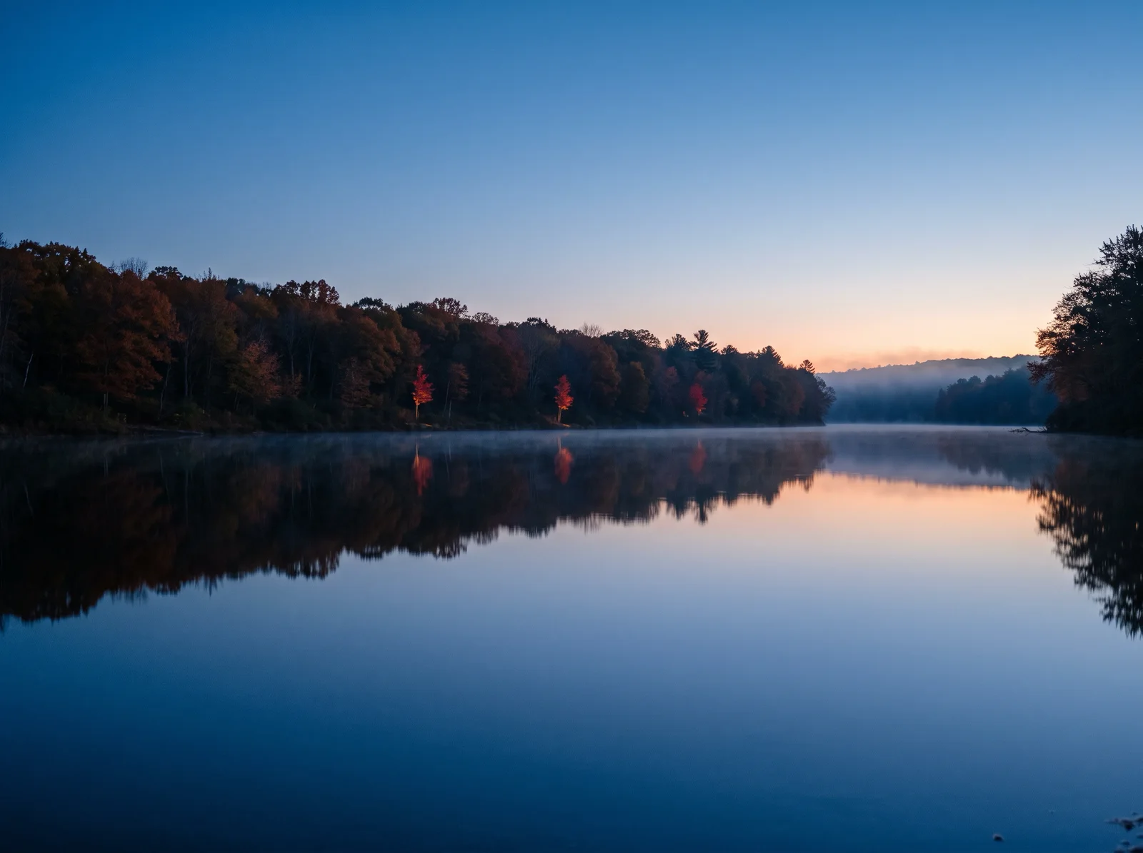 Autumn Bank Mirrored in a Still Ravine Pool at Dusk — AI-generated photograph
