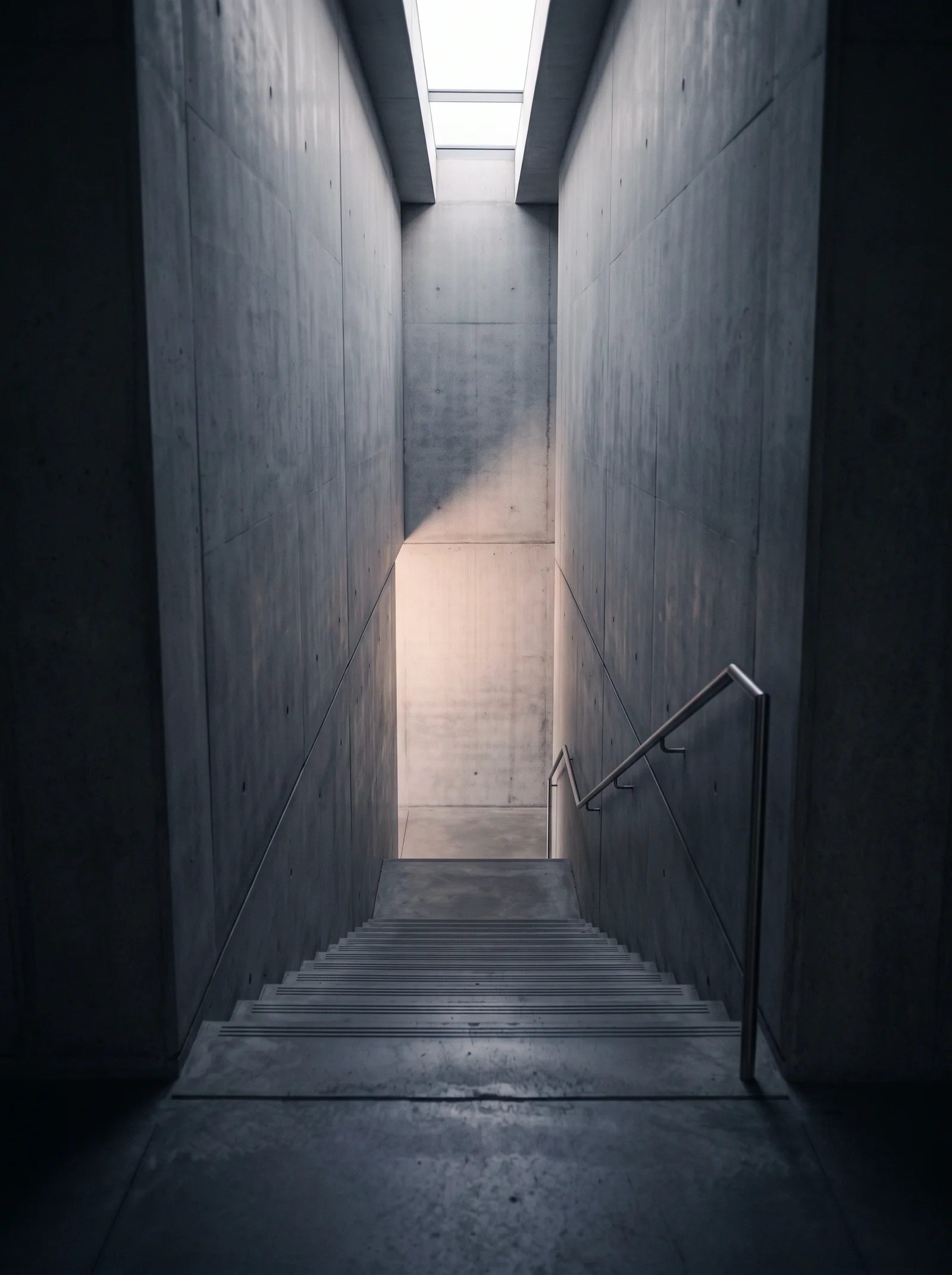 Concrete Stairwell Beneath a Skylight Shaft — AI-generated photograph