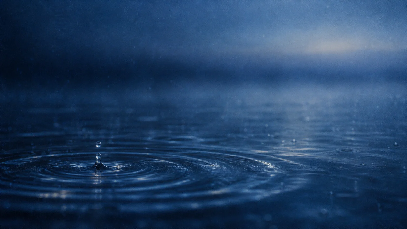 Raindrop Rising Above Blue Ripples — AI-generated photograph