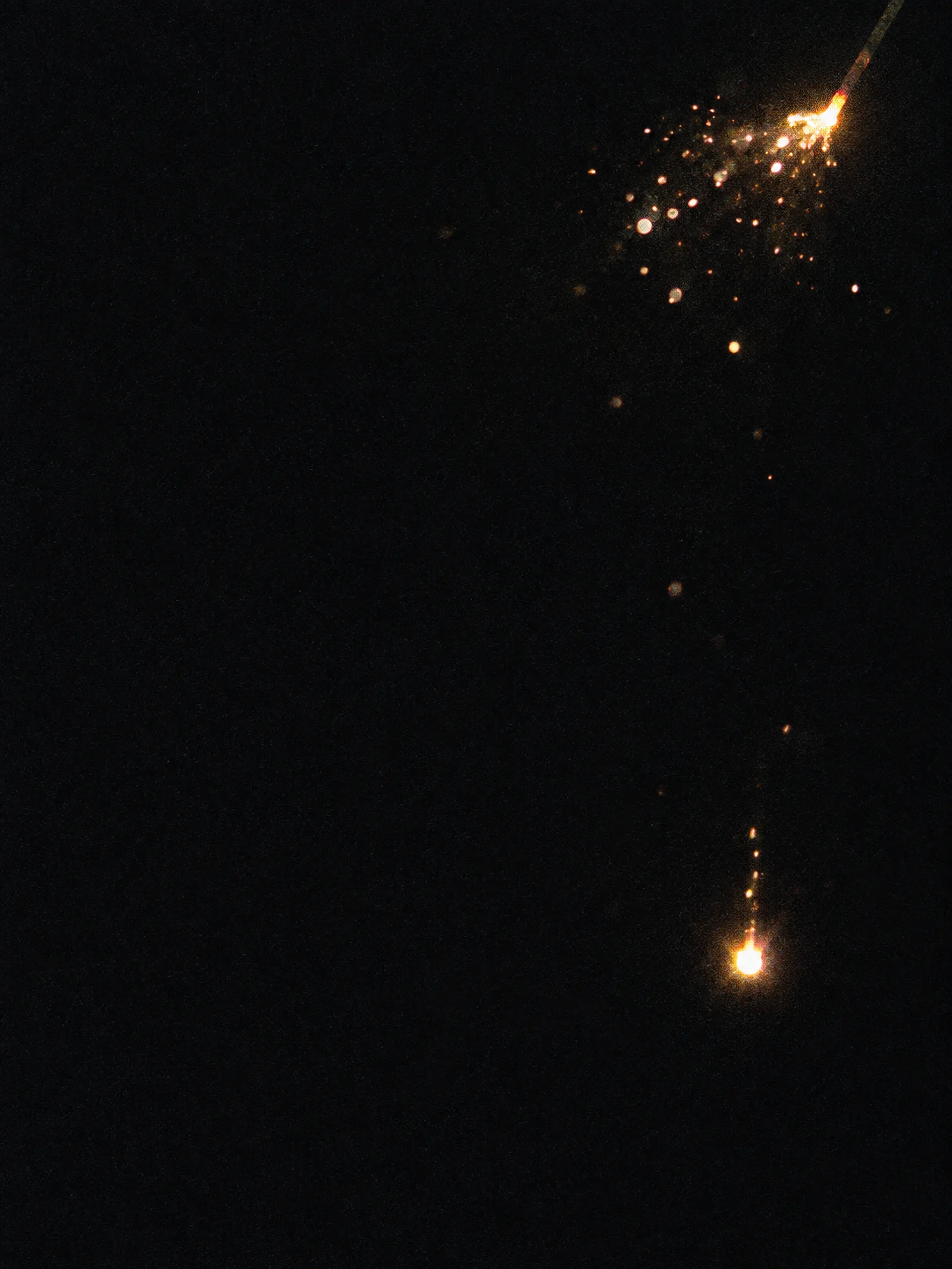 Falling Sparkler Ember in the Dark — AI-generated photograph