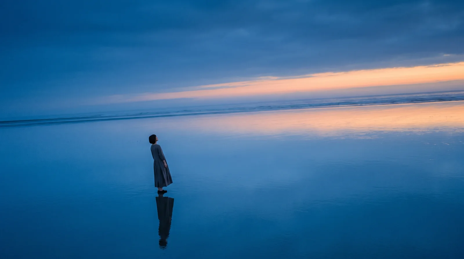 Distant Woman on a Mirror-Like Tidal Flat — AI-generated photograph