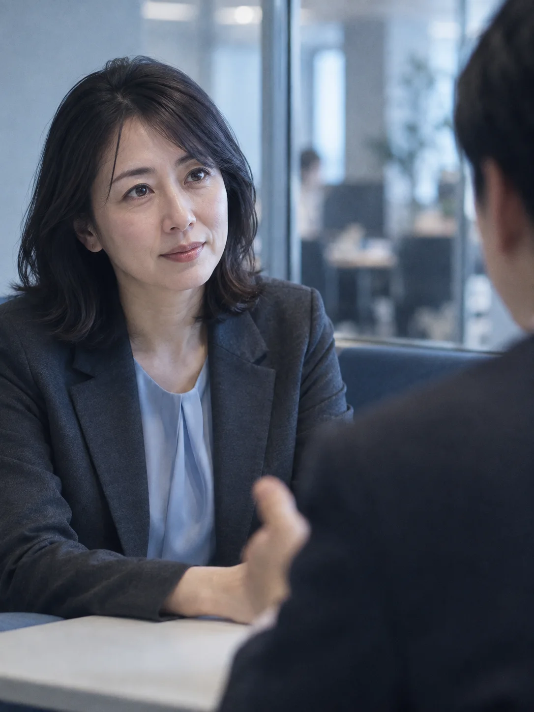 Woman Listening in a Meeting Booth — AI-generated photograph