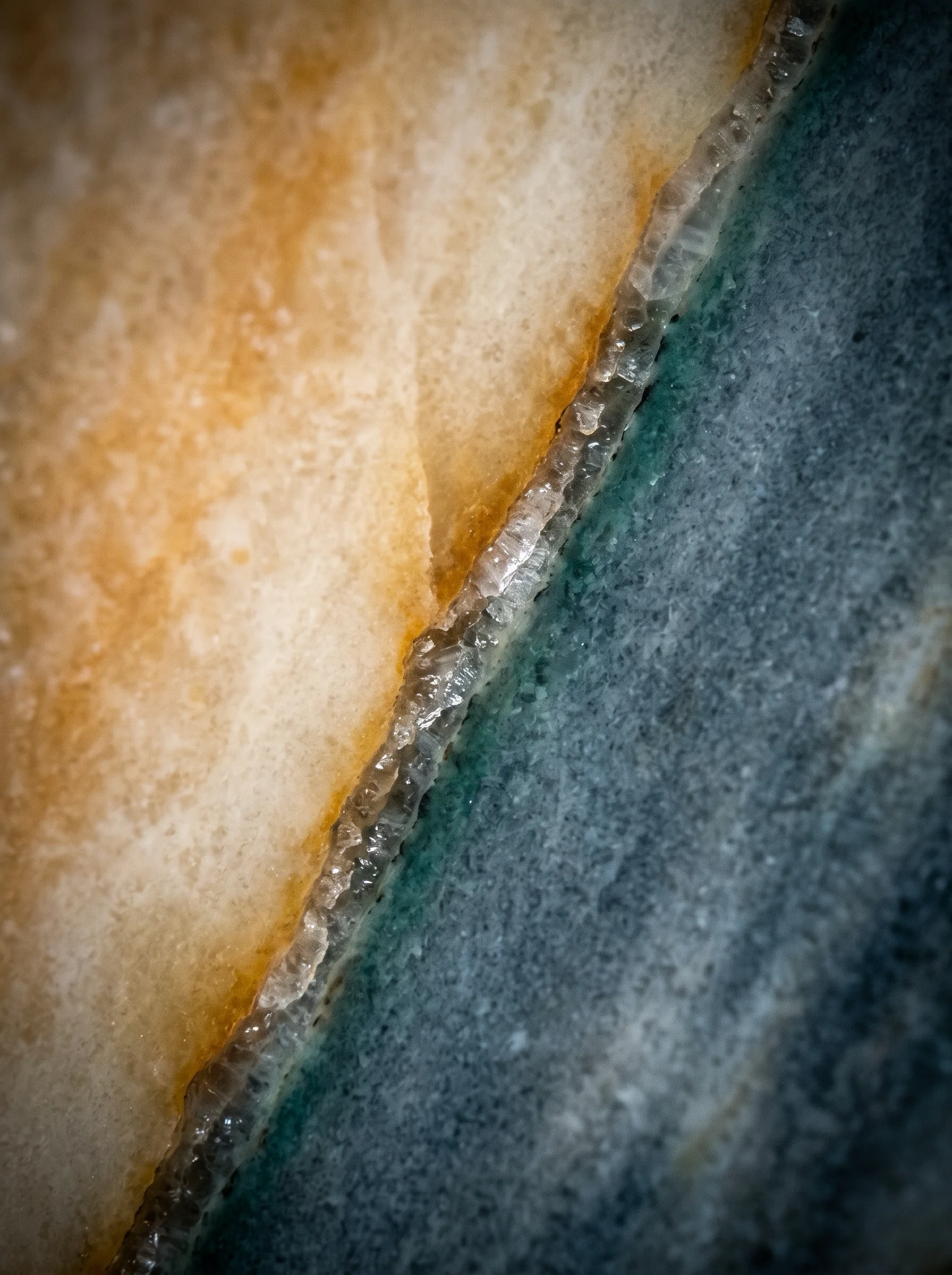 Macro of a Marble Vein Between Amber and Slate — AI-generated photograph