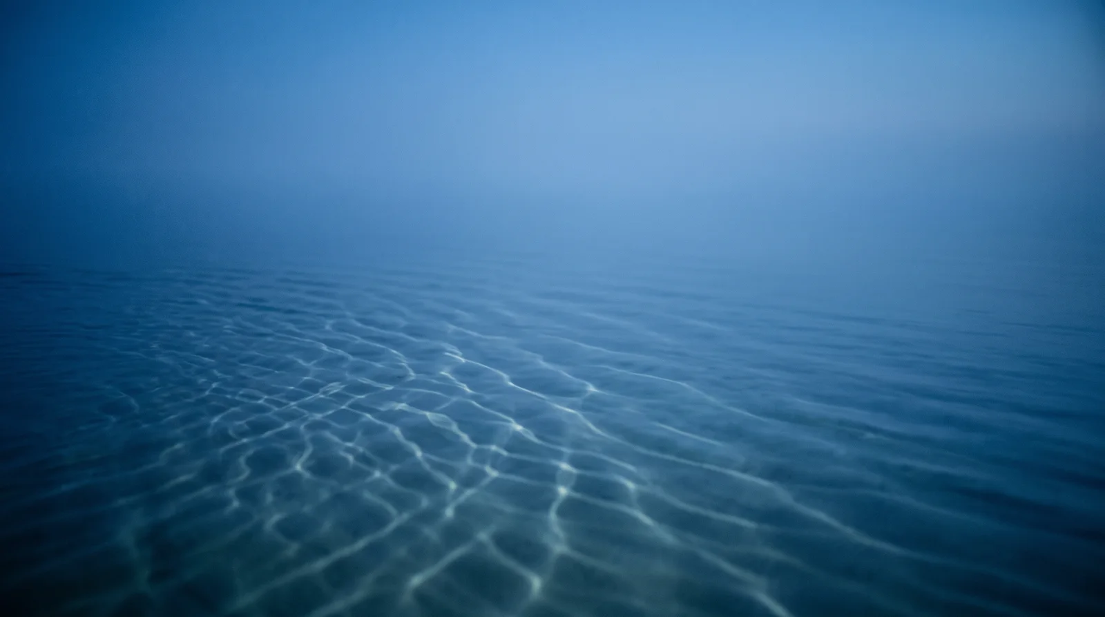 Aqua Caustic Net on Still Blue Water — AI-generated photograph