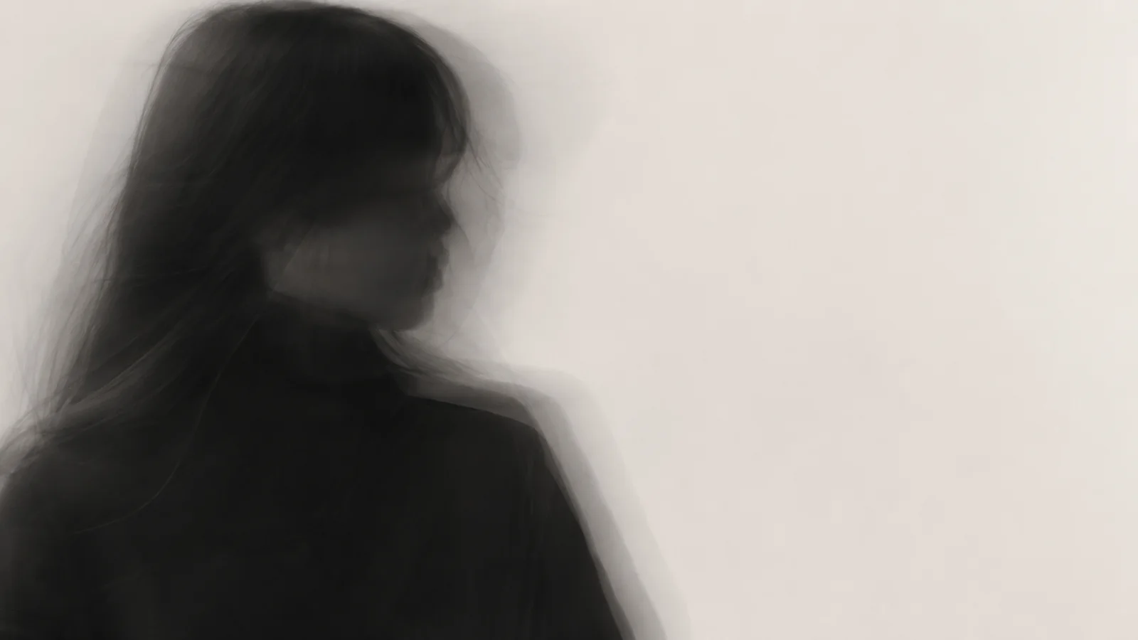 Motion-Blurred Profile of a Woman in Black with Long Exposure — AI-generated photograph