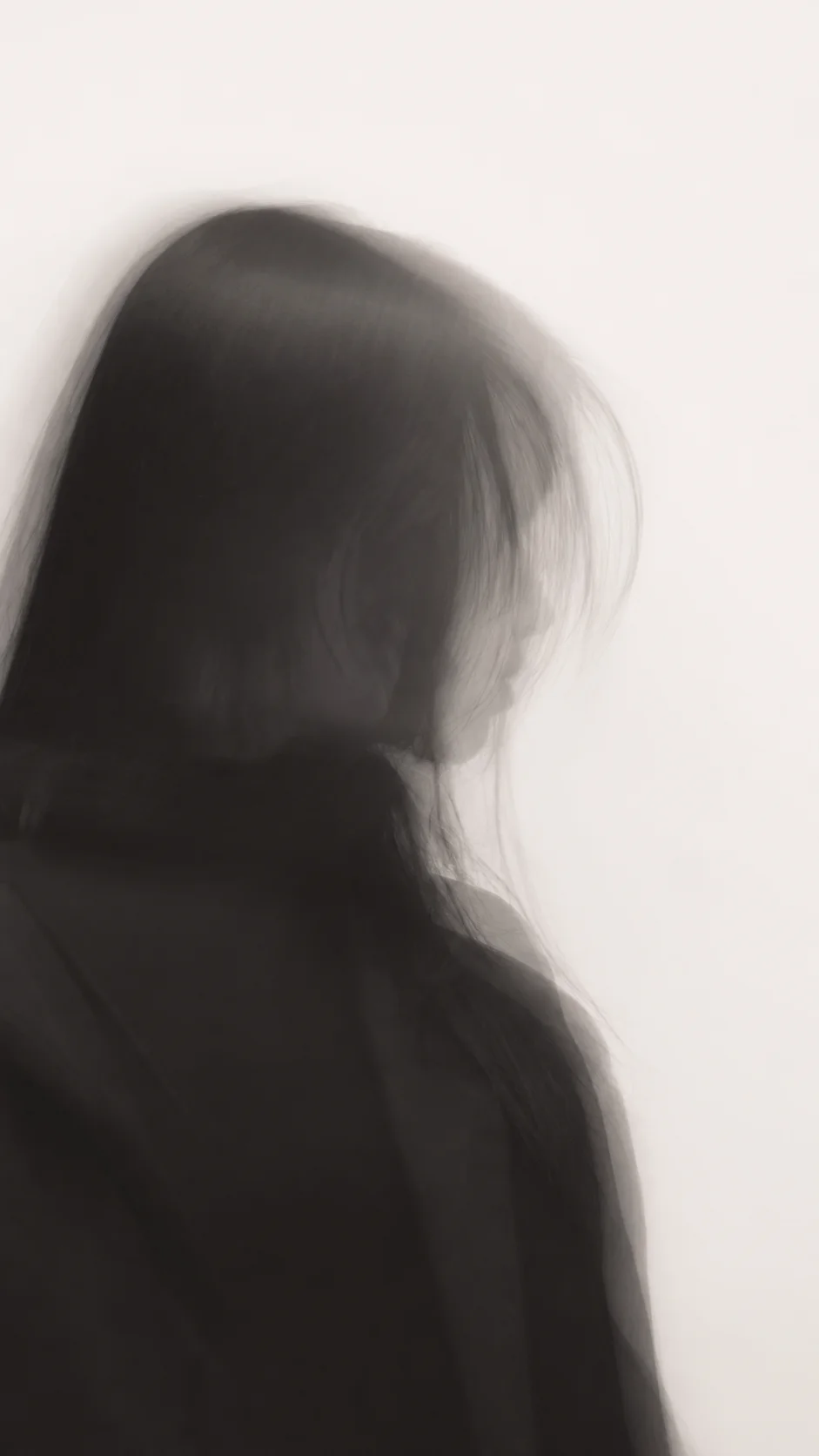 Motion-Blurred Profile of a Woman in Black with Long Exposure — AI-generated photograph
