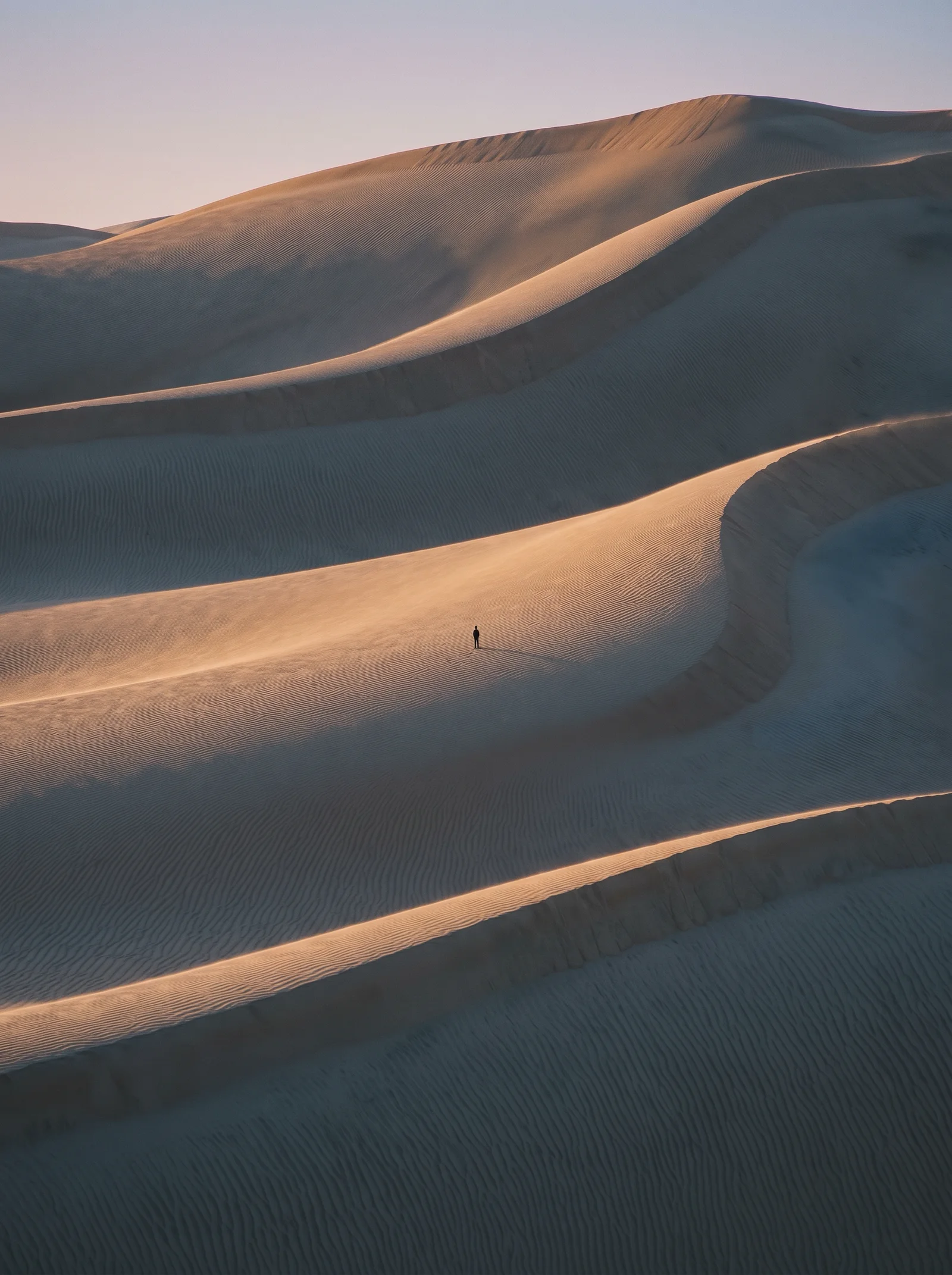 Dawn Light on Wind-Rippled Dune Ridges — AI-generated photograph