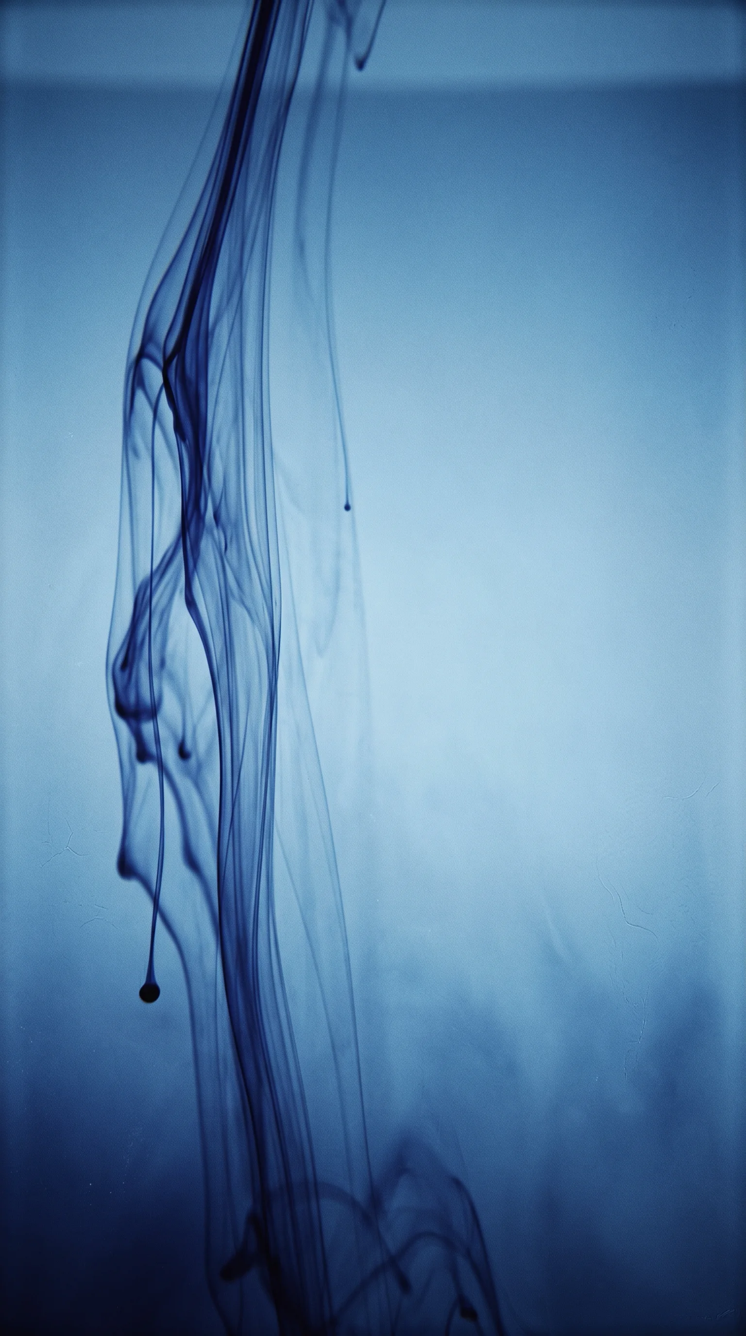 Blue Ink Diffusing in Still Water — AI-generated photograph