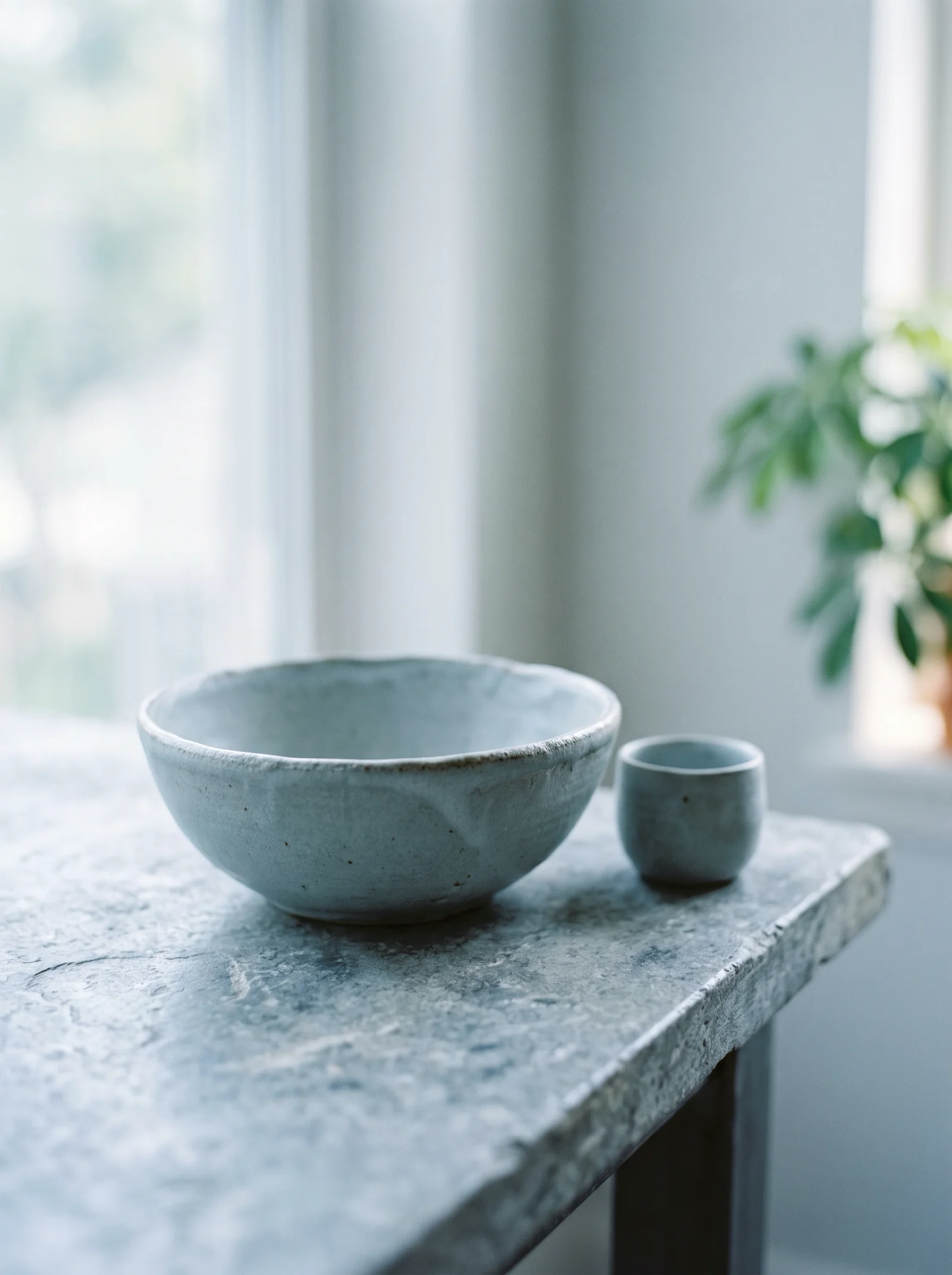 Blue-Grey Ceramic Bowl in Cool Morning Light — AI-generated photograph