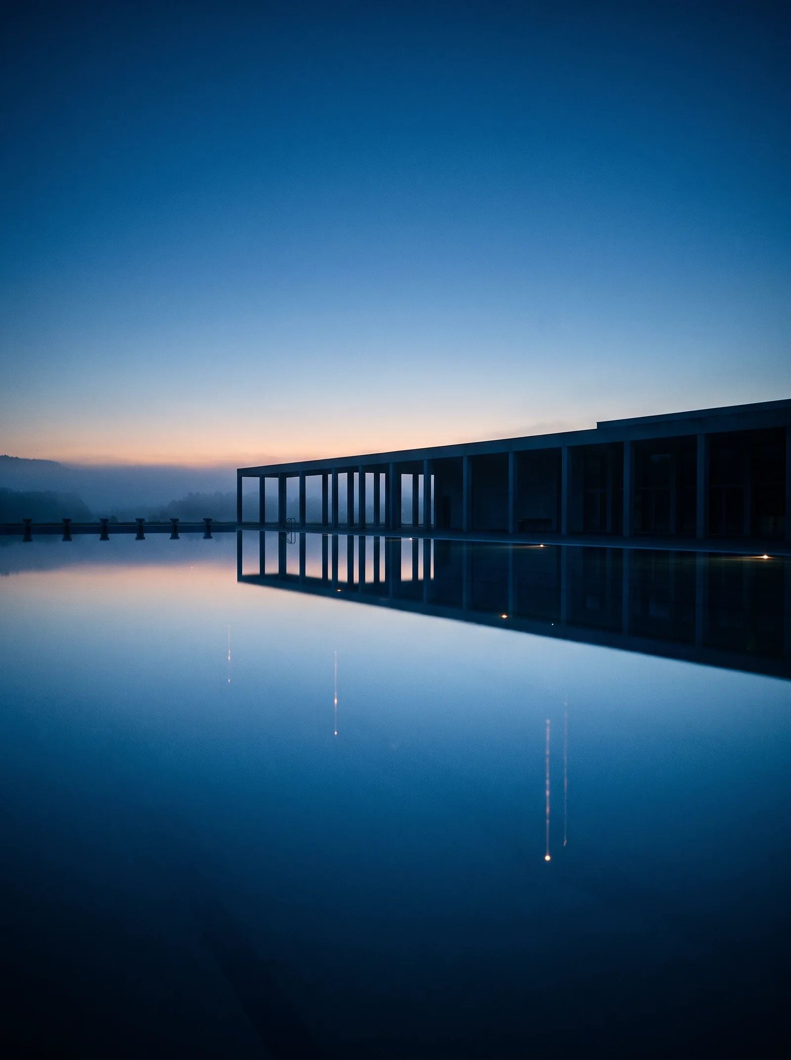 Lap Pool Mirroring Poolside Columns at Dusk — AI-generated photograph