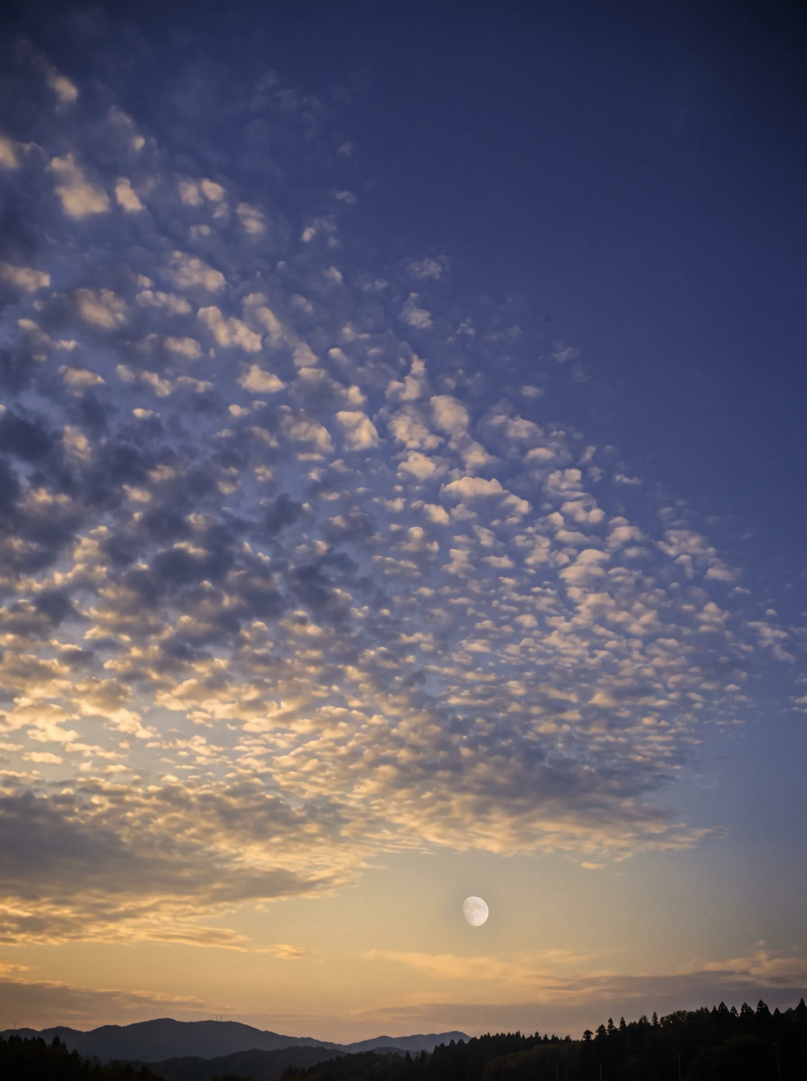 Mackerel Clouds and Pale Moon at Autumn Dusk — AI-generated photograph