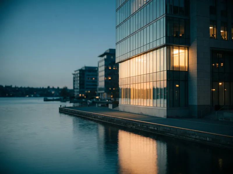 Amber-Lit Glass Tower Over Still Water — AI-generated photograph