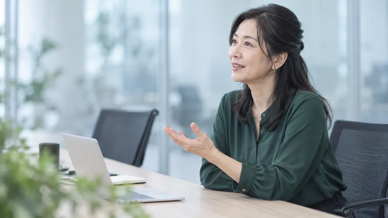 Experienced Colleague Speaking at a Meeting — AI-generated photograph
