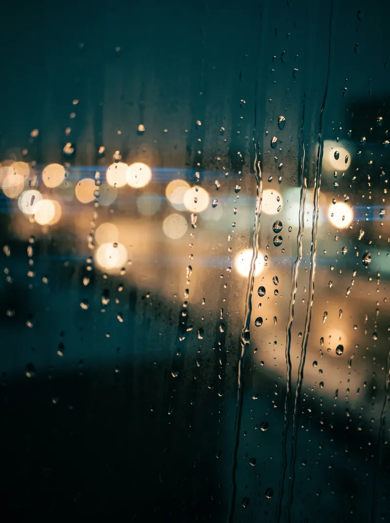 Raindrops on a Winter Window With Neon Bokeh — AI-generated photograph