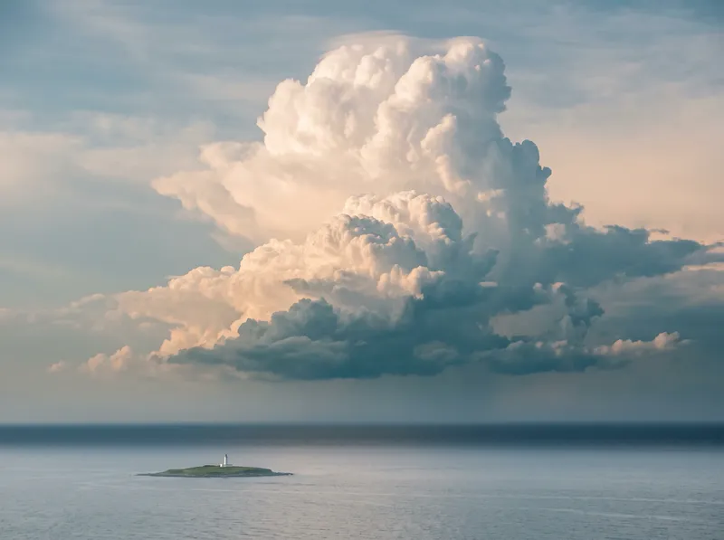 Distant Island Lighthouse Below Summer Cumulonimbus — AI-generated photograph