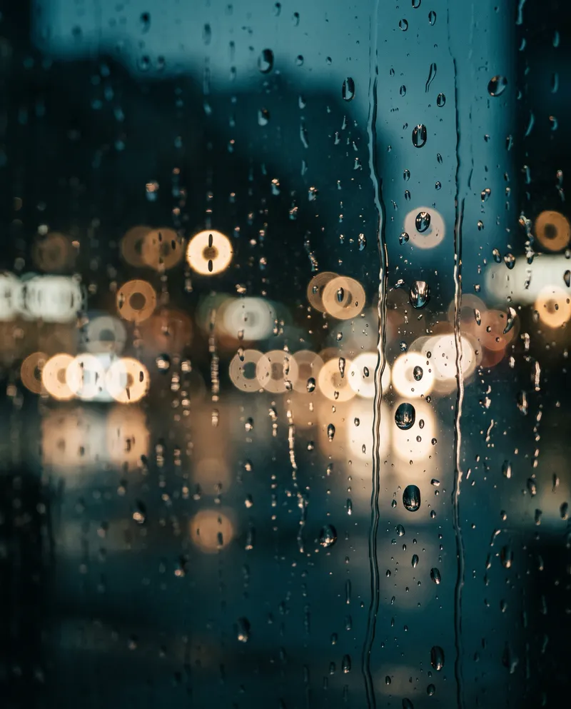 Raindrops on Glass With Ring-Shaped Bokeh — AI-generated photograph
