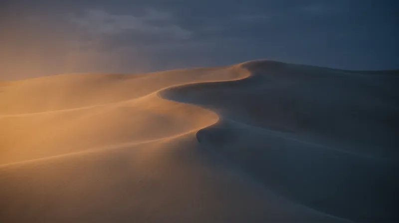 Dune Ridgeline in an Amber to Deep Blue Field — AI-generated photograph