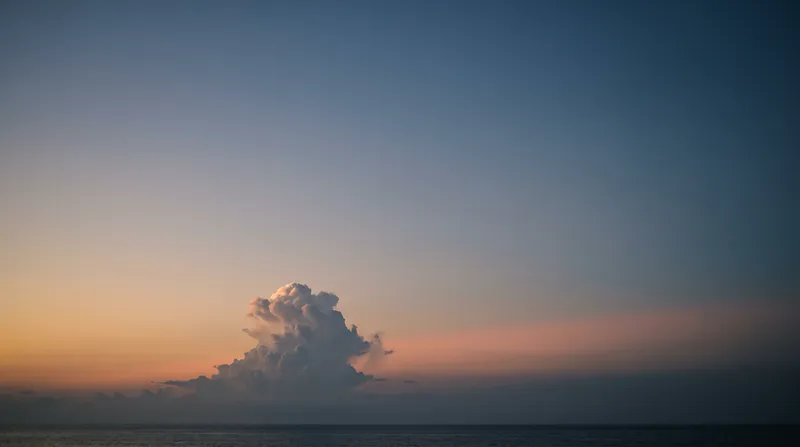 Cumulonimbus in an Amber-Blue Twilight Sky — AI-generated photograph