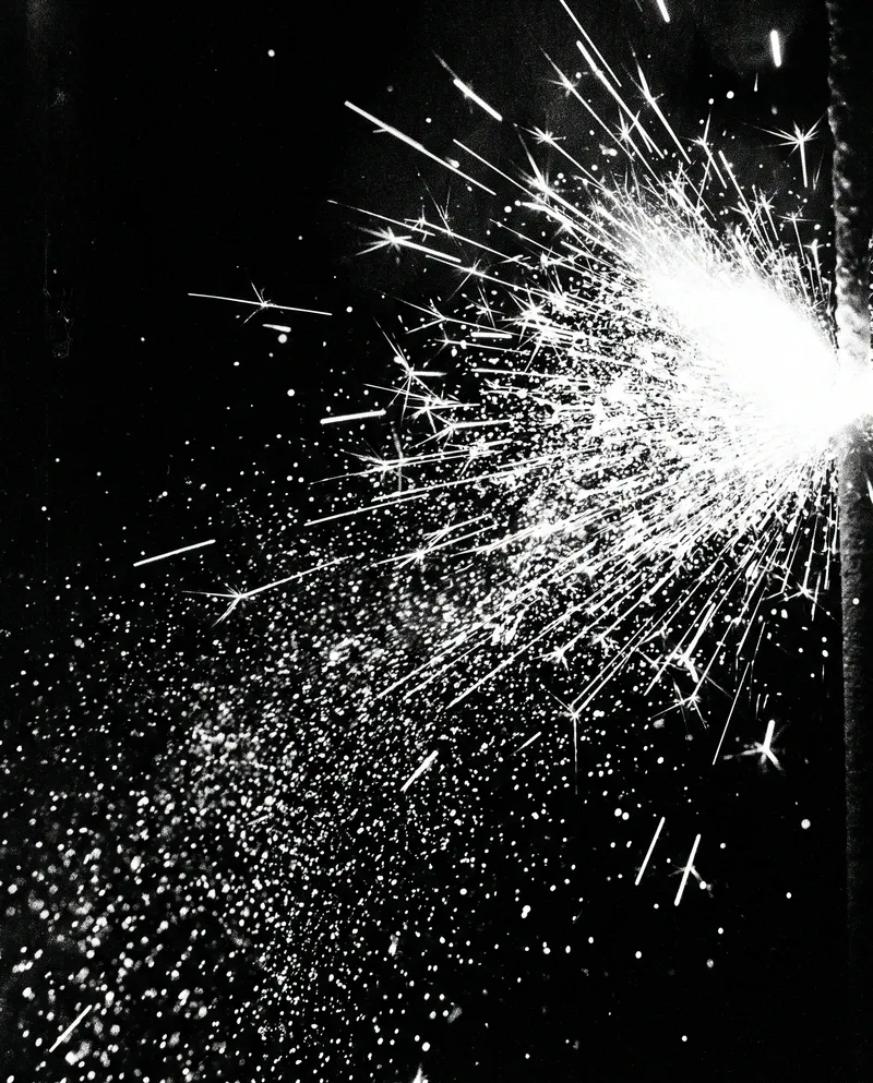 Sparkler Sparks in High-Contrast Black and White — AI-generated photograph