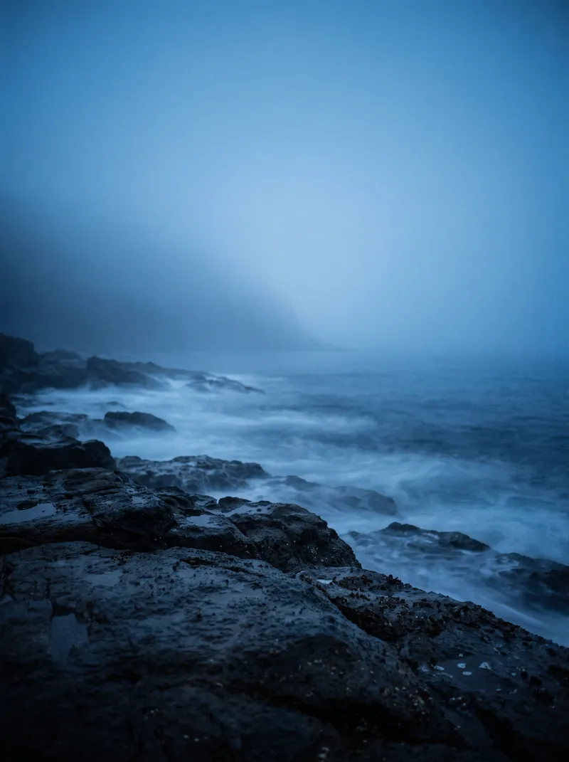 Sea Fog Drifting Over a Wet Reef at Blue Hour — AI-generated photograph