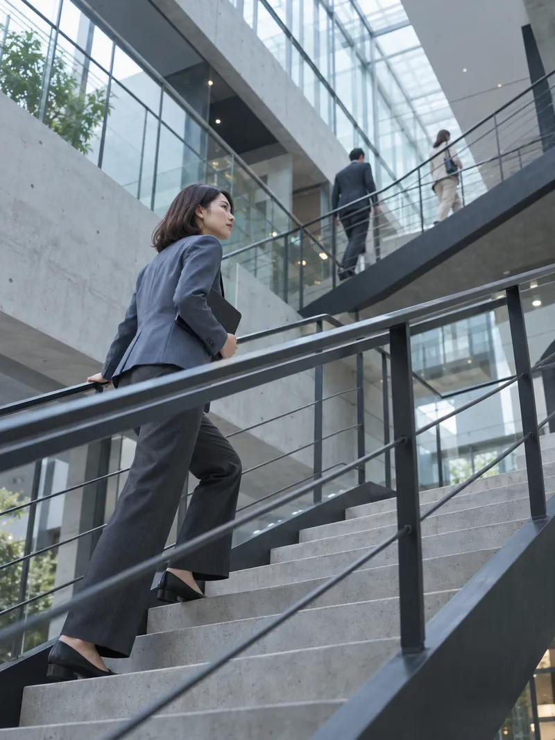 Woman Ascending an Office Staircase — AI-generated photograph