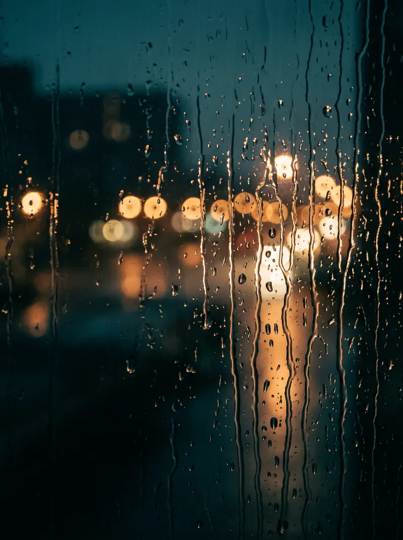 Rain Rivulets on a Cafe Window With Ring Bokeh — AI-generated photograph