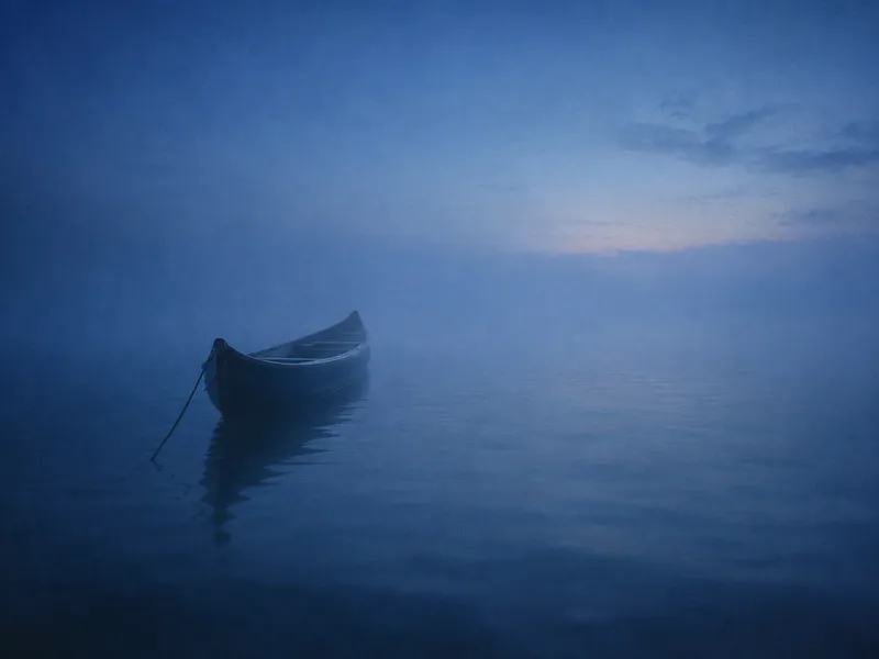 Moored Canoe in Blue Sea Fog — AI-generated photograph
