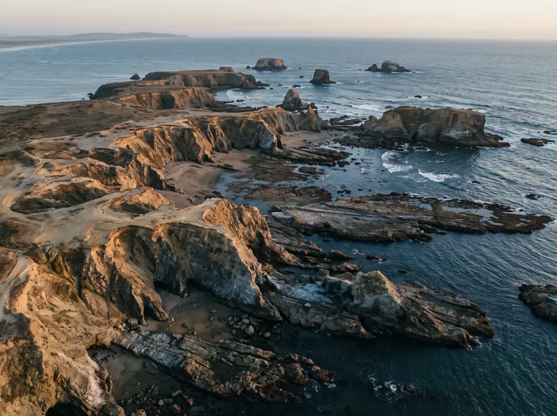 Aerial Oblique of Rugged Sea-Cliff Ridges and Stacks — AI-generated photograph