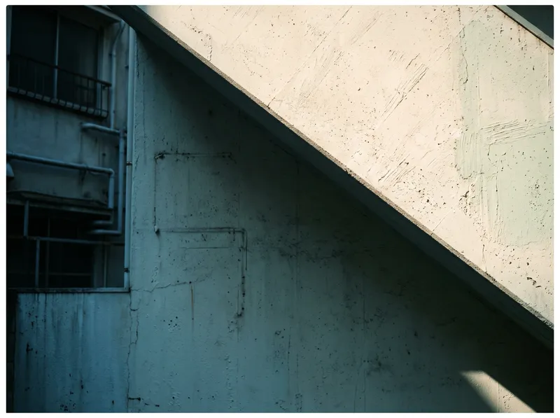 Sunlit Building Wall Meeting a Cyan Shadow — AI-generated photograph