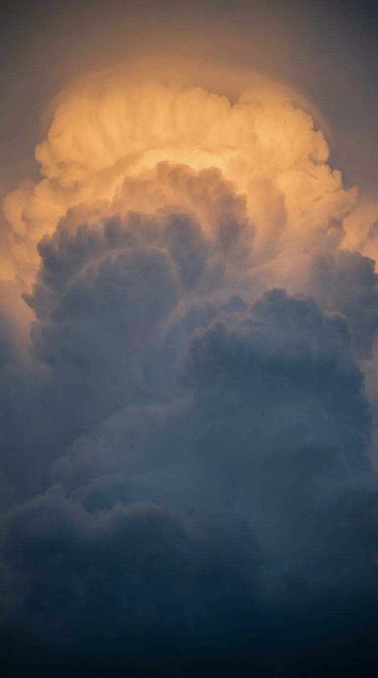 Sunlit Cumulonimbus Tower Against a Blue Gradient — AI-generated photograph