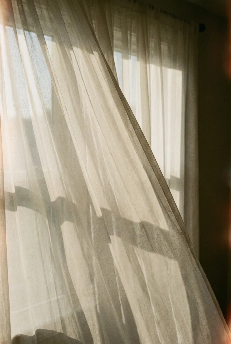 Hand Behind a Sheer Curtain — AI-generated photograph