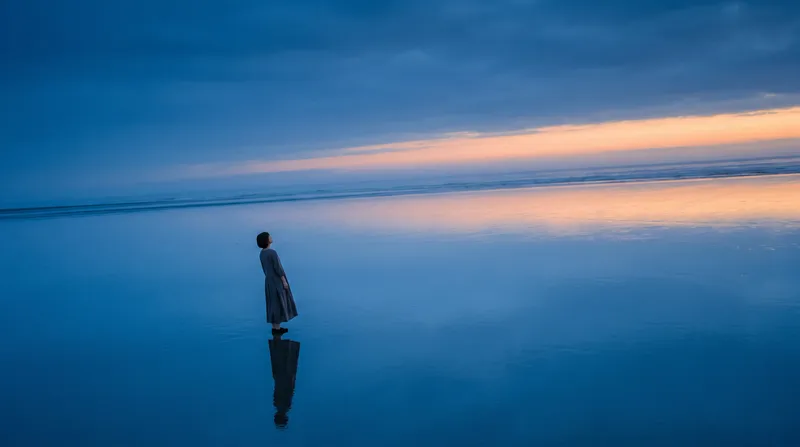 Distant Woman on a Mirror-Like Tidal Flat — AI-generated photograph