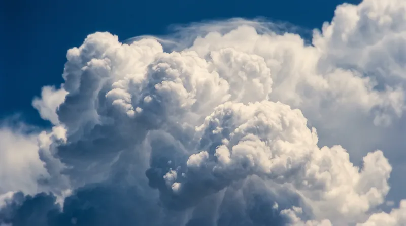 Sunlit Cumulonimbus Billows Against a Blue Sky — AI-generated photograph