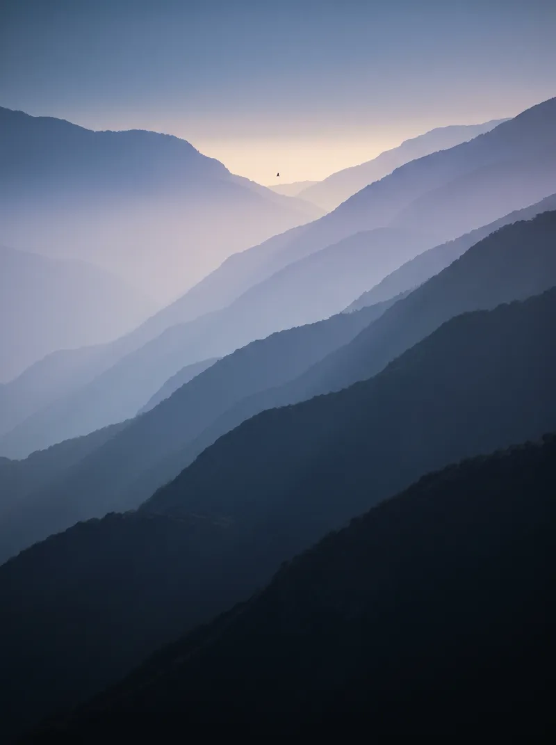Blue-Violet Ridgelines at Dusk in Fog — AI-generated photograph