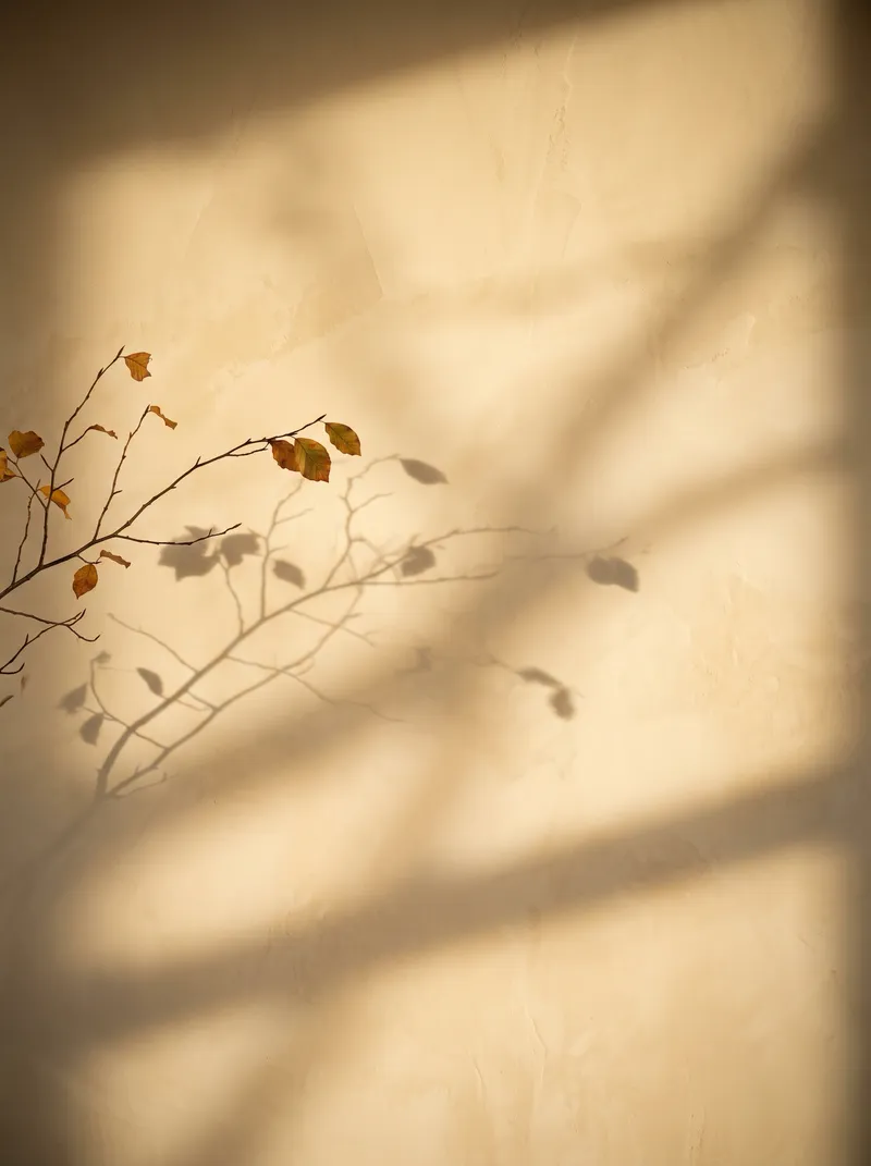 Autumn Branch Shadow on a Cream Plaster Wall — AI-generated photograph