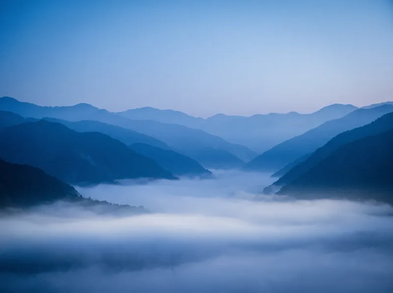 Layered Ridges Dissolving in Blue Mist — AI-generated photograph