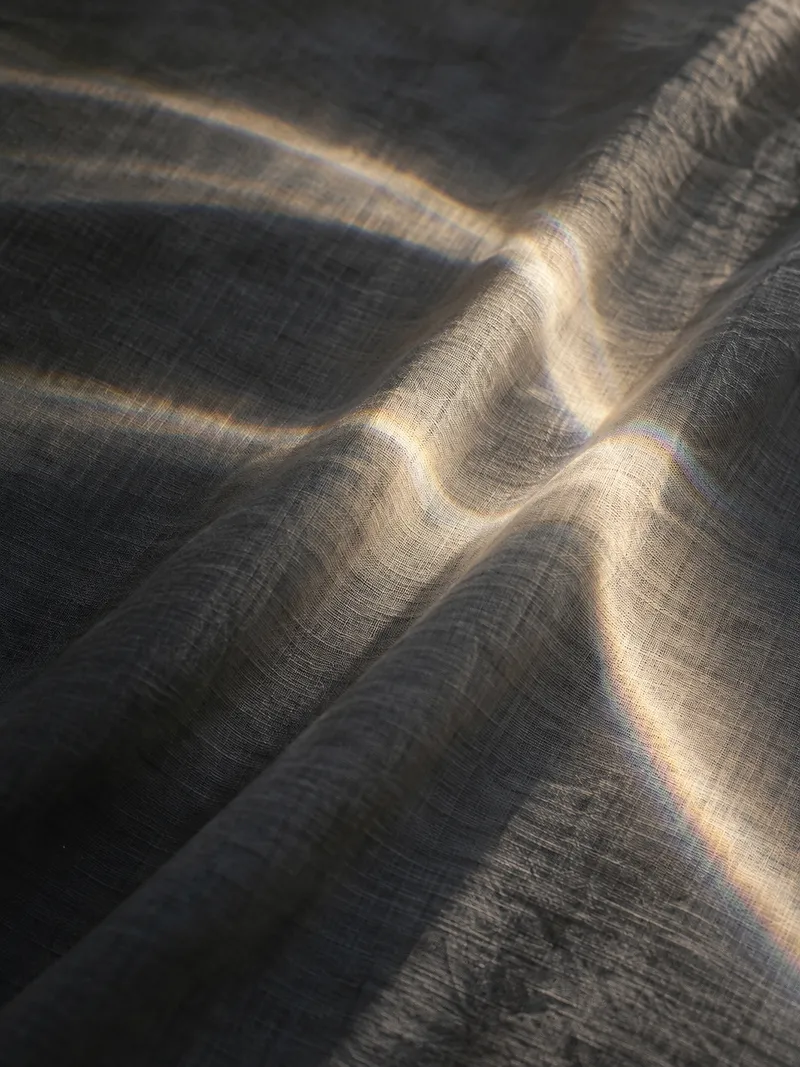 Curved Light Across White Linen — AI-generated photograph