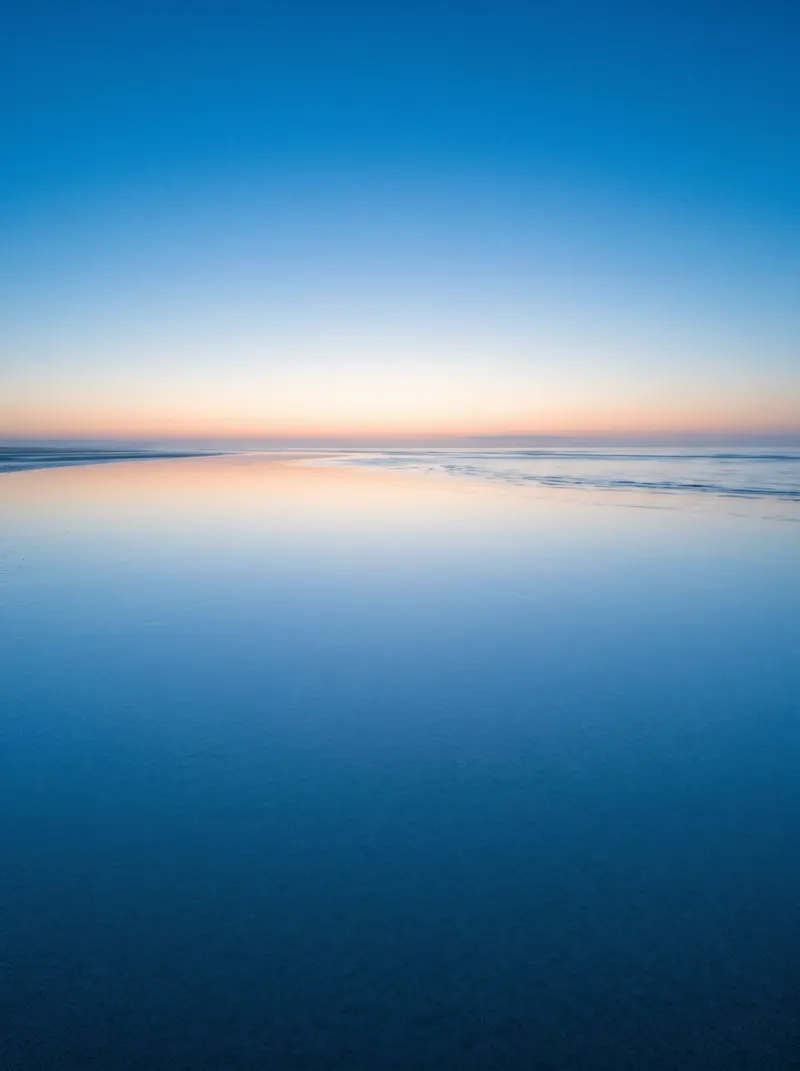 Distant Horizon Mirage on a Dawn Tidal Flat — AI-generated photograph