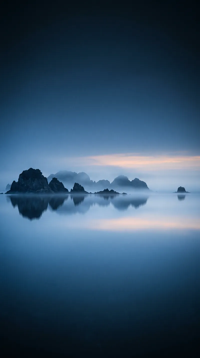 Low Rocky Islets Mirrored in a Foggy Bay — AI-generated photograph
