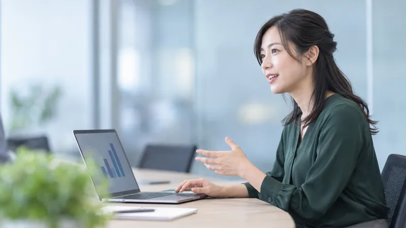 Woman Explaining at a Laptop — AI-generated photograph