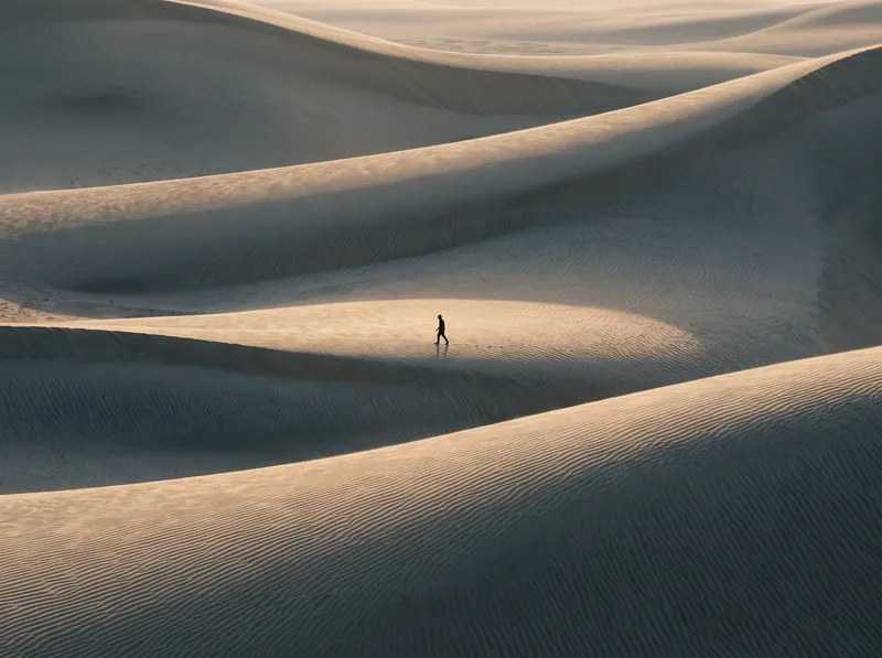 Layered Dune Ridges at Amber Dusk — AI-generated photograph