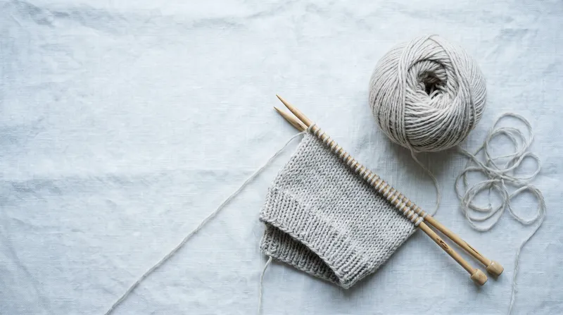 Overhead Knitting Flat-Lay on Pale Linen — AI-generated photograph