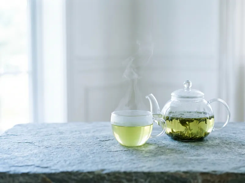 Glass Teapot and Cup in Cool Morning Light — AI-generated photograph