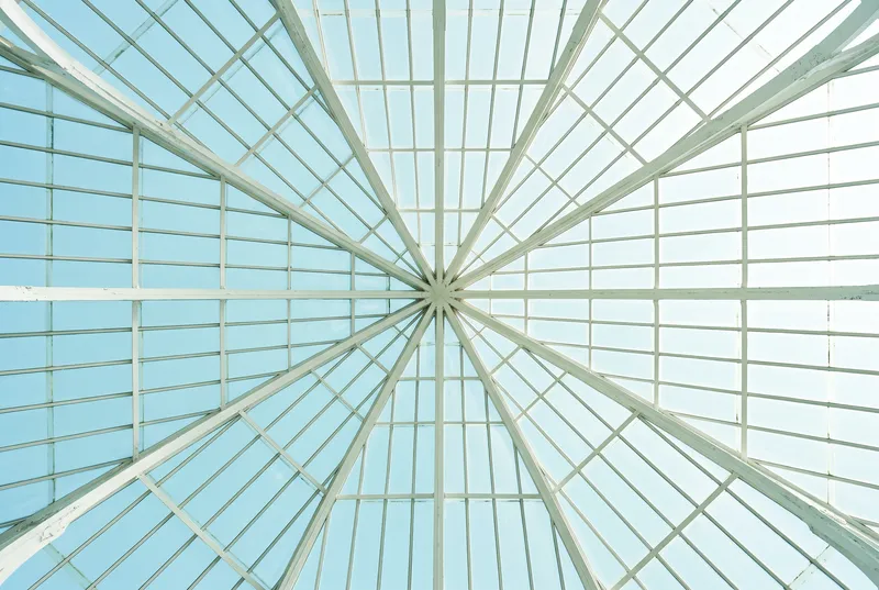 Upward View of a Glass Greenhouse Roof — AI-generated photograph