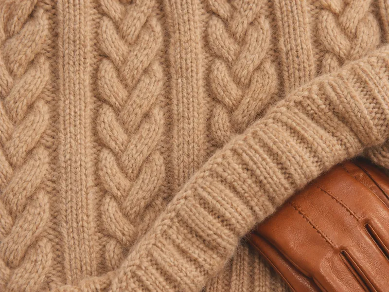 Cable Knit Folded Over a Leather Glove — AI-generated photograph