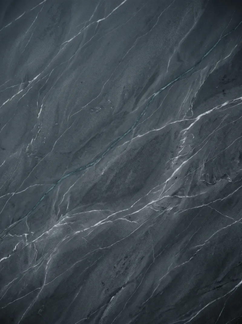 Charcoal Marble with White and Teal Veins — AI-generated photograph