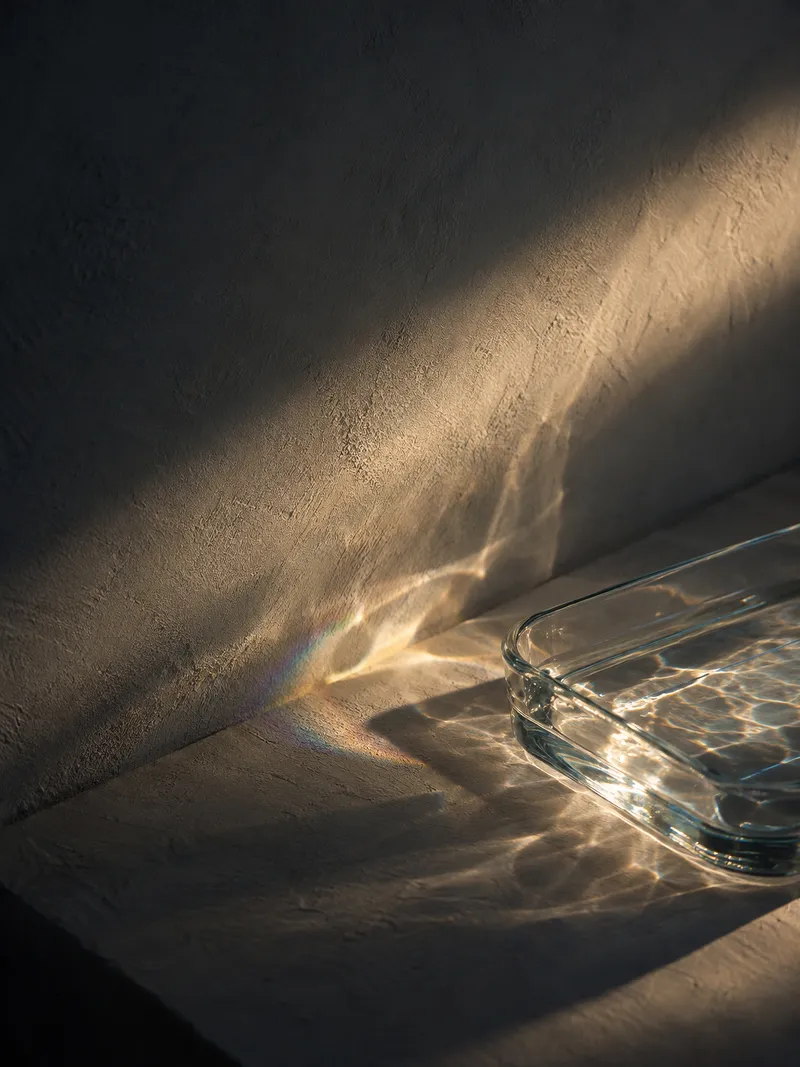 Rectangular Glass Dish Casting Light — AI-generated photograph