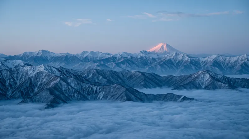 Layered Snow Ridges Catching First Alpenglow Above Clouds — AI-generated photograph